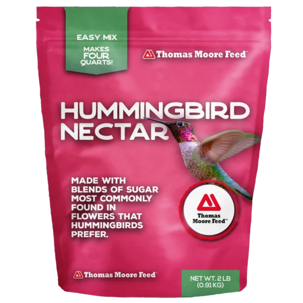 Thomas Moore Feed Hummingbird Nectar 2 lb pouch with easy mix formula, hummingbird image, and bright pink packaging