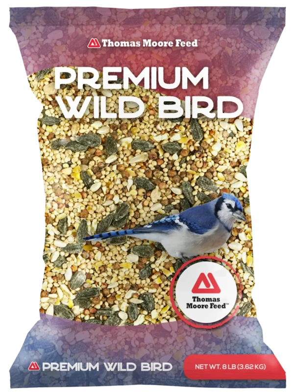 Thomas Moore Feed Premium Wild Bird 8 lb bag with mixed bird seed and blue jay on purple packaging